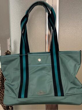 Coach Ellis Nylon Tote in Teal with Black and Teal Striped Webbing Handles.